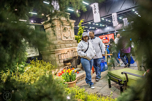 Stephanie Rowe (left) and her husband Kenneth look at a patio display during the 37th annual Spring Atlanta Home Show at the Cobb Galleria Centre in Atlanta on Sunday, March 22, 2015. 