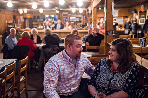 Josh Howell (left) talks to his wife Brandy as they wait for Billy Gardell to take the stage at The Punchline in Atlanta on Friday, March 20, 2015. 