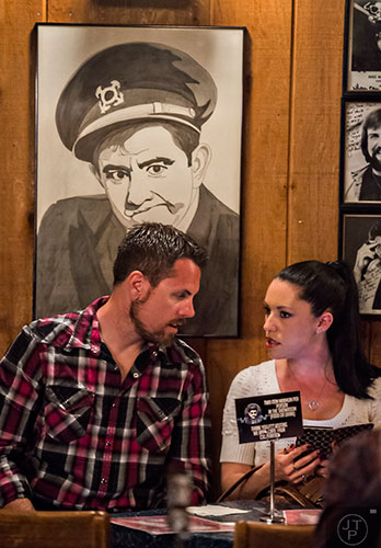 Jason Bailey (left) talks to Rachel Guy as they wait for Billy Gardell to take the stage at The Punchline in Atlanta on Friday, March 20, 2015.