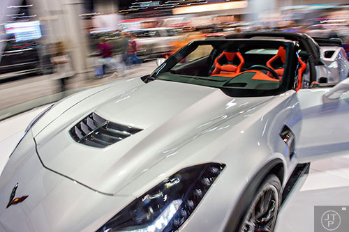 The Corvette Z06 spins on a display as thousands of people check out the Atlanta International Auto Show at the Georgia World Congress Center on Sunday, March 29, 2015. 