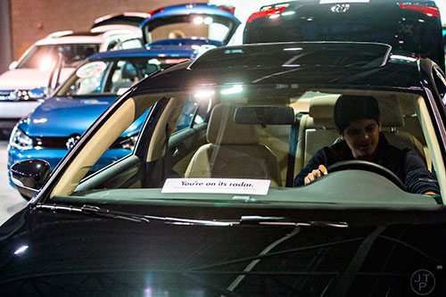 Nish Sethu sits in the drivers seat of a Volkswagen Jetta TDI SE during the Atlanta International Auto Show at the Georgia World Congress Center on Sunday, March 29, 2015. 