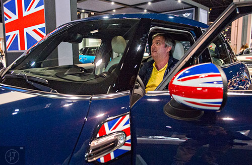Brian Johnson sits inside a Mini Cooper Hardtop four door during the Atlanta International Auto Show at the Georgia World Congress Center on Sunday, March 29, 2015.