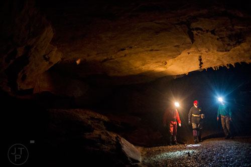 Doug Carson (left), Janice "J.J." Broome and Nancy Brown walk through the inside Frick's Cave in Chickamauga, Ga. during the Southeastern Cave Conservancy Inc.'s open house on Saturday, February 28, 2015.