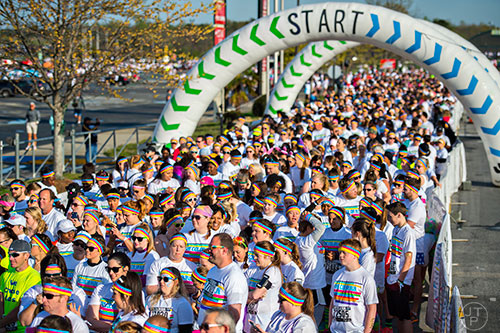 The first wave of racers line up for the start of The Color Run at Atlanta Motor Speedway in Hampton on Saturday, April 4, 2015. 