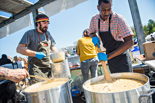 Will Mosley (right) and Michael Lennox prepare pots of gumbo during the second annual Blue Moon Beltline Boil at the Fourth Ward Skate Park along the Beltline's Eastside Trail in Atlanta on Saturday, April 4, 2015. 