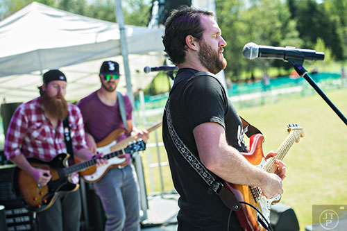 Matt Daniels (right), Logan Daniels and Trey Lander from the band Reuben's Bell perform on stage during the second annual Blue Moon Beltline Boil at the Fourth Ward Skate Park along the Beltline's Eastside Trail in Atlanta on Saturday, April 4, 2015.