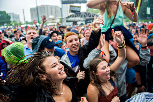 Maria Robinson (left) dances as Aer performs on stage during the SweetWater 420 Fest at Centennial Olympic Park in Atlanta on Friday, April 17, 2015. 