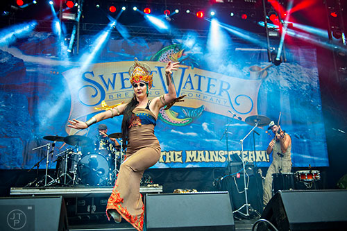 Zoe Jakes (center), Tommy Cappel and David Satori of Beats Antique perform on stage during the SweetWater 420 Fest at Centennial Olympic Park in Atlanta on Friday, April 17, 2015. 