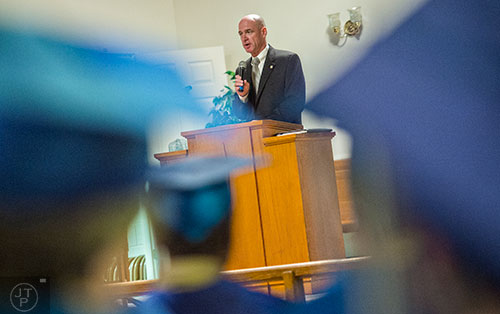L.C. "Buster" Evans speaks during the graduation ceremony for theological studies at the Lee Arrendale Correctional Facility in Alto on Friday, April 10, 2015. 