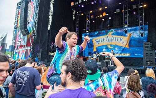 Russ Harper (center) dances while up on a friend's shoulders as the Kyle Hollingsworth Band performs during the last day of the SweetWater 420 Fest at Centennial Olympic Park in Atlanta on Sunday, April 19, 2015. 