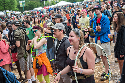 Sarah Fry (right), Justin Battles and Ruth Sayger watch the Kyle Hollingsworth Band perform during the last day of the SweetWater 420 Fest at Centennial Olympic Park in Atlanta on Sunday, April 19, 2015. 