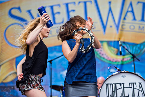 Delta Rae's Brittany Holljes (left) and Elizabeth Hopkins perform on stage during the last day of the SweetWater 420 Fest at Centennial Olympic Park in Atlanta on Sunday, April 19, 2015. 