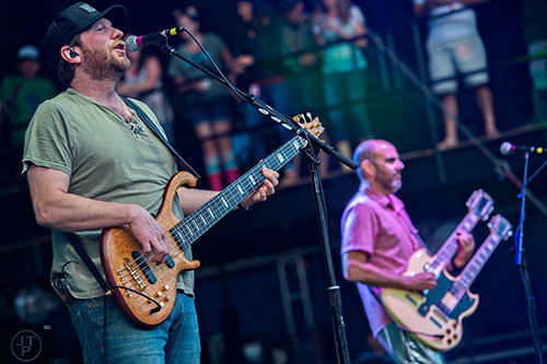 Moe.'s Rob Derhak (left) and Al Schnier perform on stage during the last day of the SweetWater 420 Fest at Centennial Olympic Park in Atlanta on Sunday, April 19, 2015. 