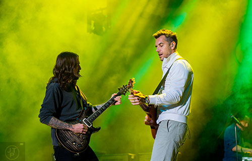 311's Nick Hexum (right) and Tim Mahoney perform on stage during the last day of the SweetWater 420 Fest at Centennial Olympic Park in Atlanta on Sunday, April 19, 2015.