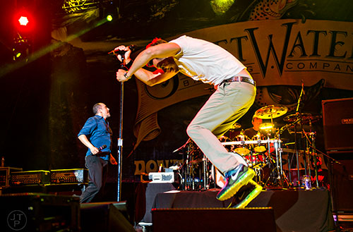 311's Nick Hexum (right) and S.A. Martinez perform on stage during the last day of the SweetWater 420 Fest at Centennial Olympic Park in Atlanta on Sunday, April 19, 2015. 