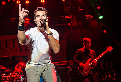 311's Nick Hexum (left) and P-Nut perform on stage during the last day of the SweetWater 420 Fest at Centennial Olympic Park in Atlanta on Sunday, April 19, 2015.