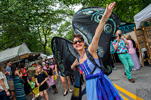 Sunshine Allard (right) leads off the parade during the Inman Park Festival in Atlanta on Saturday, April 25, 2015. 