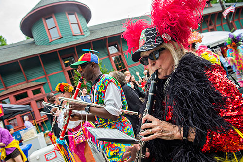Brenda Findley (right) plays her clarinet with the Seed & Feed Marching Abominable as she marches in the parade during the Inman Park Festival in Atlanta on Saturday, April 25, 2015. The two day festival featured artists, musicians, food, a tour of homes, the parade and activities for children.   JONATHAN PHILLIPS / SPECIAL