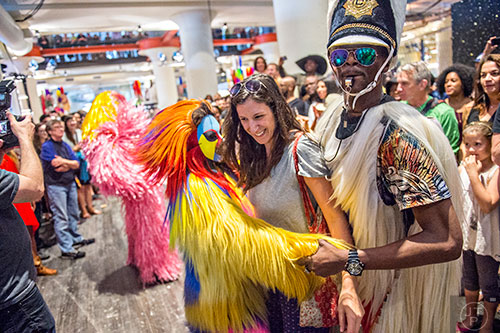 Tina Tuozzoli (center) is pulled in between two dancers as they perform during Nick Cave's Up Right: Atlanta performance at Ponce City Market on Sunday, April 26, 2015. 