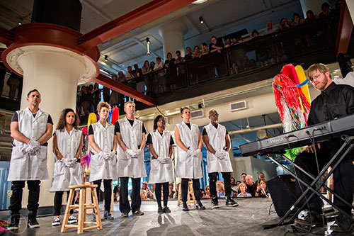 Performers wait for dancers to come onto the stage during Nick Cave's Up Right: Atlanta performance at Ponce City Market on Sunday, April 26, 2015. 