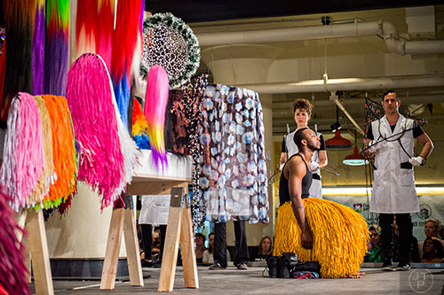 Dancers are dressed in their costumes during Nick Cave's Up Right: Atlanta performance at Ponce City Market on Sunday, April 26, 2015. 