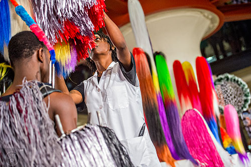 Dancers are dressed in their costumes during Nick Cave's Up Right: Atlanta performance at Ponce City Market on Sunday, April 26, 2015. 