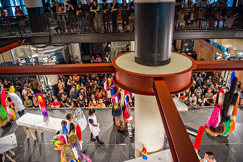 A crowd of around 700 people surround the stage as they watch Nick Cave's Up Right: Atlanta performance at Ponce City Market on Sunday, April 26, 2015. 