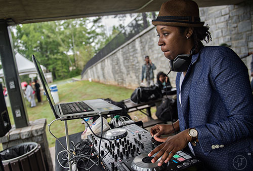 DJ Sed the Saint spins some tunes during the Paws for a Cause event at Glenlake Park in Decatur on Saturday, April 18, 2015.