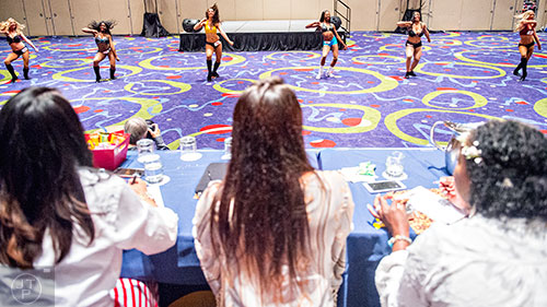 Six hopefuls run through their routine in front of the judges during tryouts for the Atlanta Falcons Cheerleaders at the Georgia International Convention Center in Atlanta on Sunday, May 3, 2015.