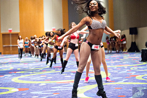 Brionna Trevillion (right) dances during tryouts for the Atlanta Falcons Cheerleaders at the Georgia International Convention Center in Atlanta on Sunday, May 3, 2015. 