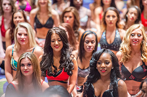 Jessica Pollard (right) listens to instructions from the judges after completing the first  round of tryouts for the Atlanta Falcons Cheerleaders at the Georgia International Convention Center in Atlanta on Sunday, May 3, 2015. 