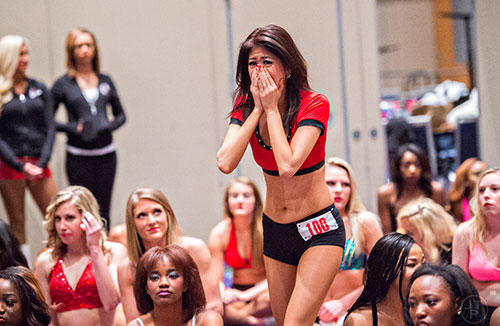 Sakiko Yamaguchi reacts as her number is called to move onto the second round of tryouts for the Atlanta Falcons Cheerleaders at the Georgia International Convention Center in Atlanta on Sunday, May 3, 2015. 