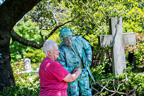 Barbara Smith (left) shakes hands with a Beethoven dressed Bob Seymore during the Arts at Oakland presents Roam Transmissions' The Cryptophonic Tour at Oakland Cemetery in Atlanta on Saturday, May 2, 2015. 