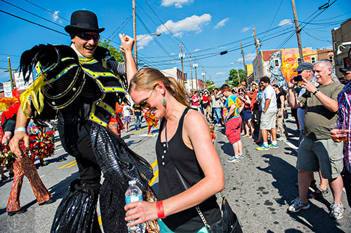 Tim Mack dances with Hannah Robinson during the Fire in the Fourth Festival in the Old Fourth Ward neighborhood of Atlanta on Saturday, May 2, 2015. 