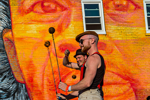 Jake Guinn (right) and Justin Conley perform with fire during the Fire in the Fourth Festival in the Old Fourth Ward neighborhood of Atlanta on Saturday, May 2, 2015. 