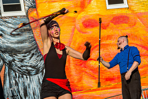 Charlotte Dillard (left) and Cosmo Franz perform with fire during the Fire in the Fourth Festival in the Old Fourth Ward neighborhood of Atlanta on Saturday, May 2, 2015. 