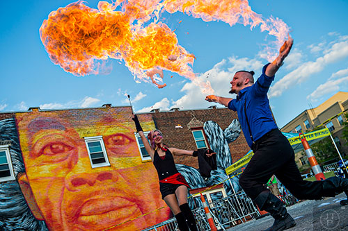 Cosmo Franz (right) and Charlotte Dillard perform with fire during the Fire in the Fourth Festival in the Old Fourth Ward neighborhood of Atlanta on Saturday, May 2, 2015. 