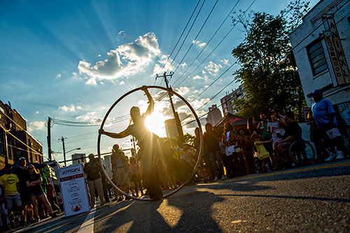 Ann Marie Spexet performs with a cyr wheel during the Fire in the Fourth Festival in the Old Fourth Ward neighborhood of Atlanta on Saturday, May 2, 2015.