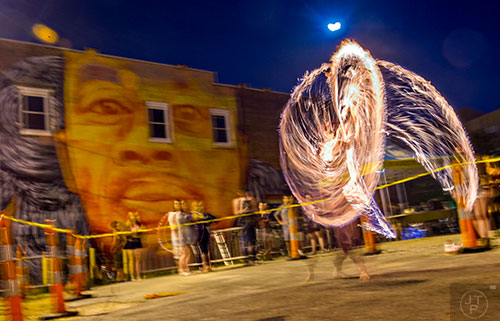 Justin Conley spins fire during the Fire in the Fourth Festival in the Old Fourth Ward neighborhood of Atlanta on Saturday, May 2, 2015. 