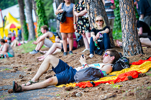 Ryan Dadmun lays in the shade during the first day of the Shaky Knees Music Festival at Central Park in Atlanta on Friday, May 8, 2015. The Pixies, Mastodon, 