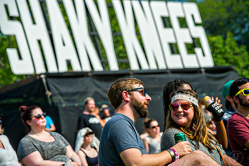 Julie Dembo (right) laughs as she talks with Brian Oakes during the first day of the Shaky Knees Music Festival at Central Park in Atlanta on Friday, May 8, 2015. 