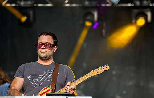 TV on the Radio's Dave Sitek performs on stage during the first day of the Shaky Knees Music Festival at Central Park in Atlanta on Friday, May 8, 2015. 