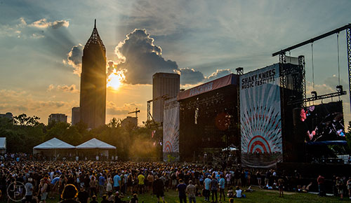 The sun sets over the Peachtree Stage during the first day of the Shaky Knees Music Festival at Central Park in Atlanta on Friday, May 8, 2015. 