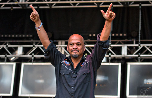 Joey Santiago plays up to the crowd as the Pixies take the stage during the first day of the Shaky Knees Music Festival at Central Park in Atlanta on Friday, May 8, 2015.