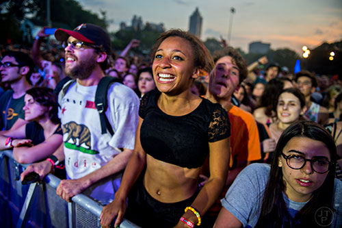 Jessica Jones (center) cheers as the Pixies perform on stage during the first day of the Shaky Knees Music Festival at Central Park in Atlanta on Friday, May 8, 2015. 