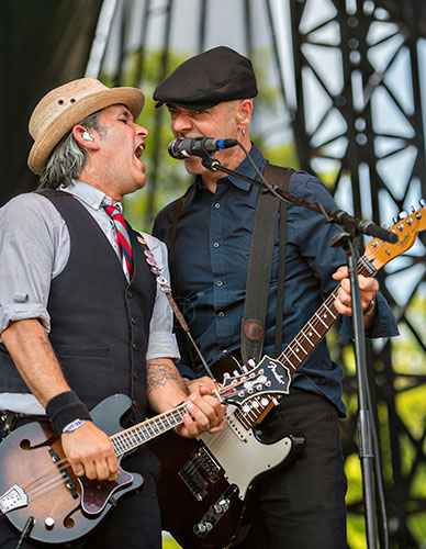 Flogging Molly's Bob Schmidt (left) and and Dennis Casey perform on stage during the Shaky Knees Music Festival at Central Park in Atlanta on Saturday, May 9, 2015. 