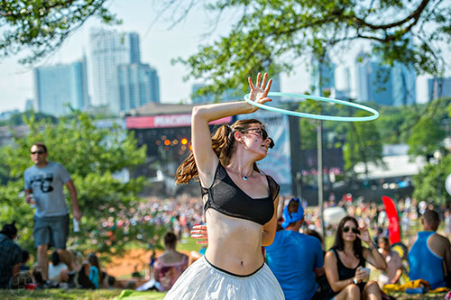 Haley Leopold dances with her hula hoop during the Shaky Knees Music Festival at Central Park in Atlanta on Saturday, May 9, 2015. 