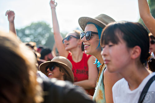 Becka Cowan (center) listens to Interpol perform during the Shaky Knees Music Festival at Central Park in Atlanta on Saturday, May 9, 2015. 