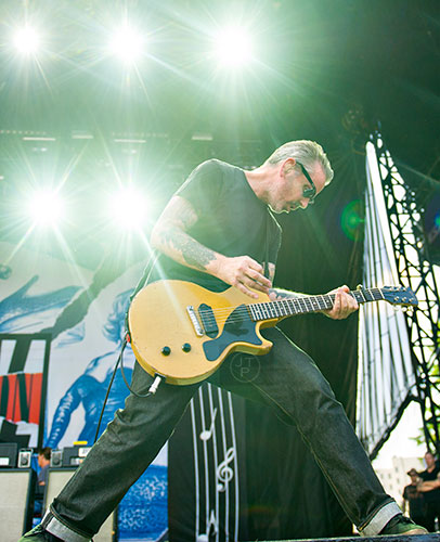 Social Distortion's Jonny Wickersham performs on stage during the Shaky Knees Music Festival at Central Park in Atlanta on Saturday, May 9, 2015.