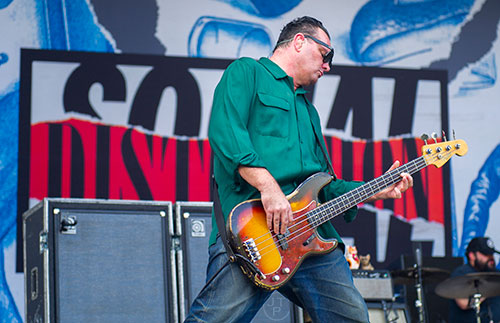 Social Distortion's Brent Harding performs on stage during the Shaky Knees Music Festival at Central Park in Atlanta on Saturday, May 9, 2015. 